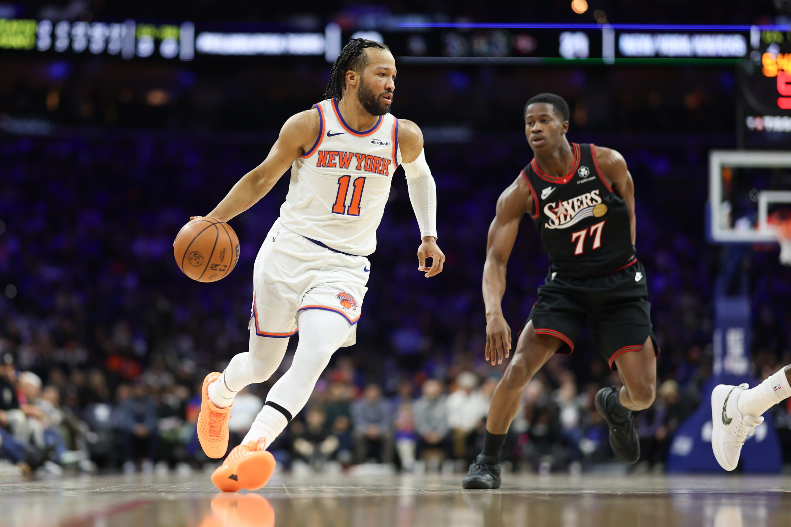 Jan 24, 2026; Philadelphia, Pennsylvania, USA; New York Knicks guard Jalen Brunson (11) dribbles the ball in front of Philadelphia 76ers guard Vj Edgecombe (77) during the first quarter at Xfinity Mobile Arena. Mandatory Credit: Bill Streicher-Imagn Images