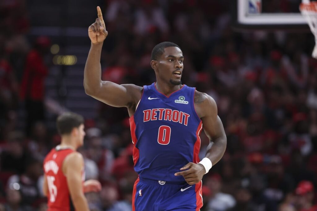 Houston, Texas, USA; Detroit Pistons center Jalen Duren (0) reacts after making a basket during the second quarter against the Houston Rockets at Toyota Center. Mandatory Credit: Troy Taormina-Imagn Images