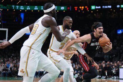 Miami Heat forward Jaime Jaquez Jr. (11) drives the ball against Boston Celtics guard Jaylen Brown (7) in the first quarter at TD Garden.