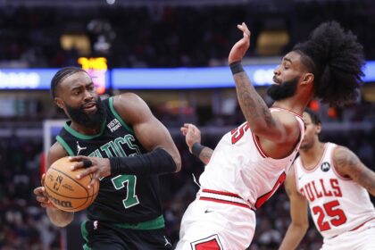 Boston Celtics guard Jaylen Brown (7) goes to the basket against Chicago Bulls guard Coby White (0) during the second half at United Center.