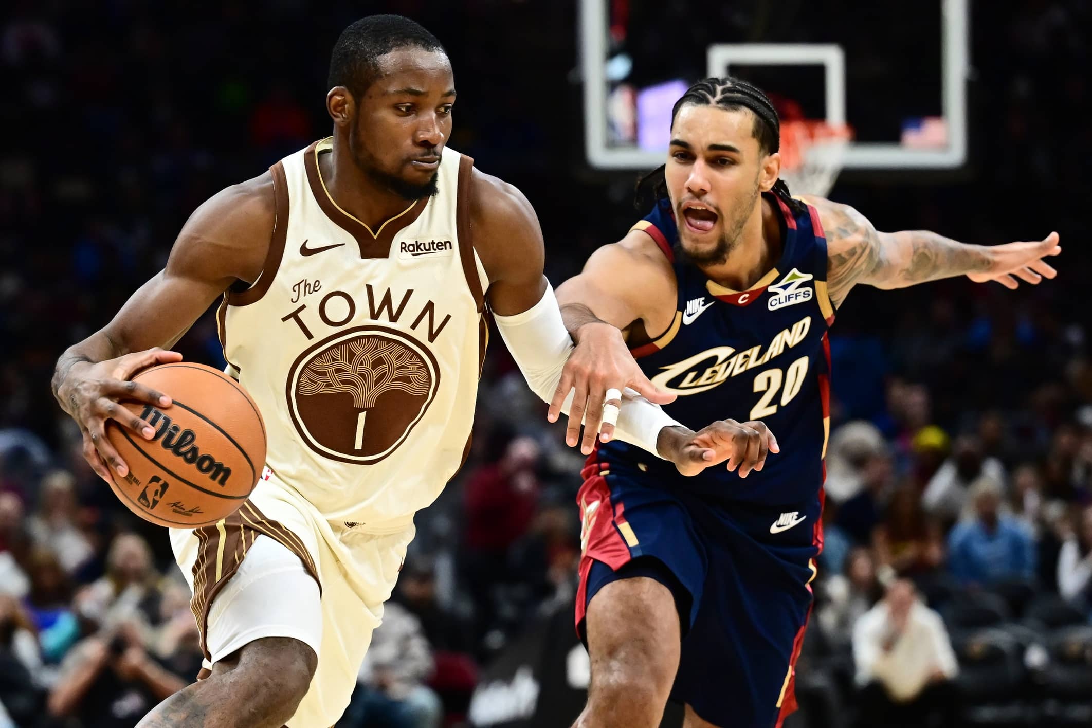 Golden State Warriors forward Jonathan Kuminga (1) drives to the basket against Cleveland Cavaliers guard Jaylon Tyson (20) during the second half at Rocket Arena.