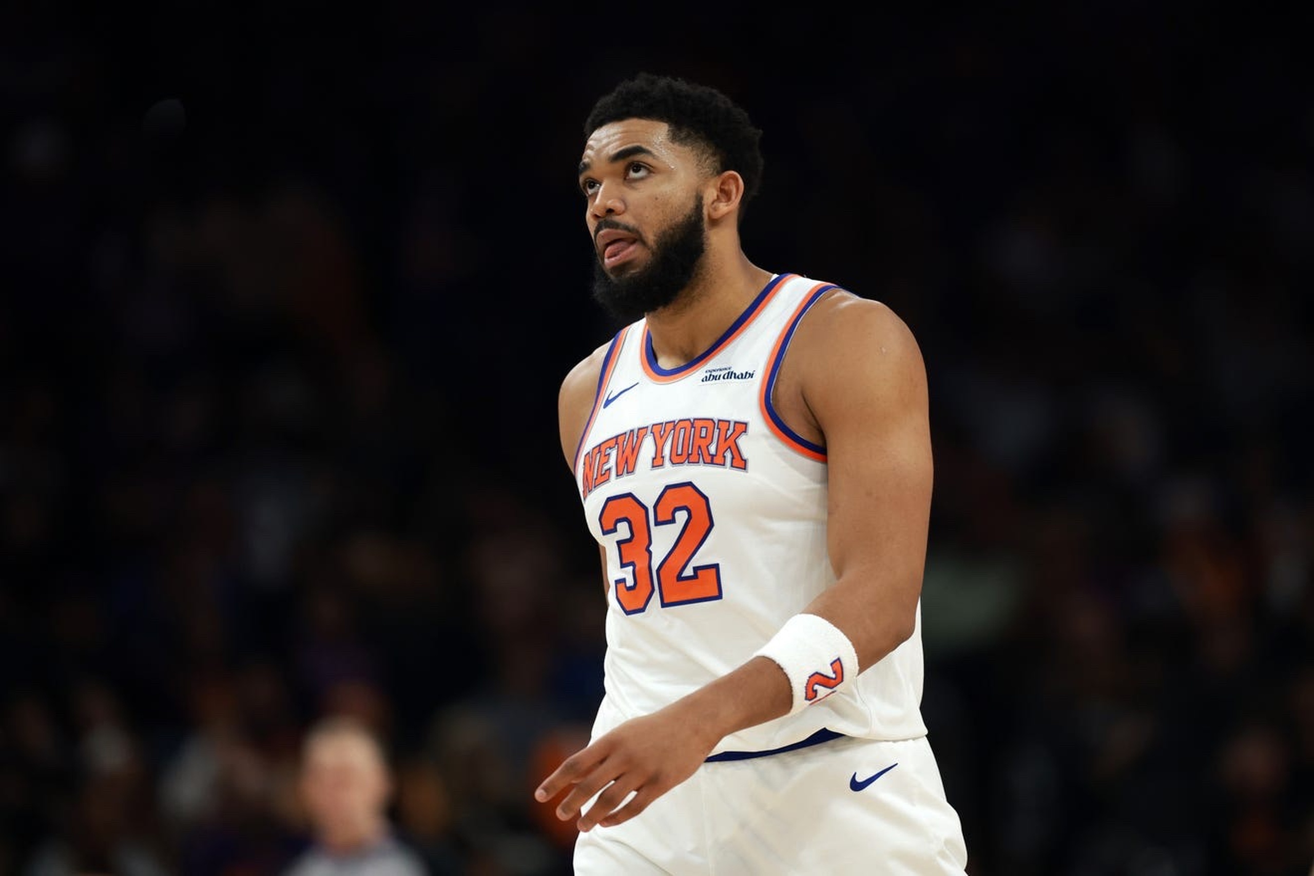 Jan 9, 2026; Phoenix, Arizona, USA; New York Knicks center Karl-Anthony Towns (32) reacts against the Phoenix Suns in the first half at Mortgage Matchup Center. Mandatory Credit: Mark J. Rebilas-Imagn Images