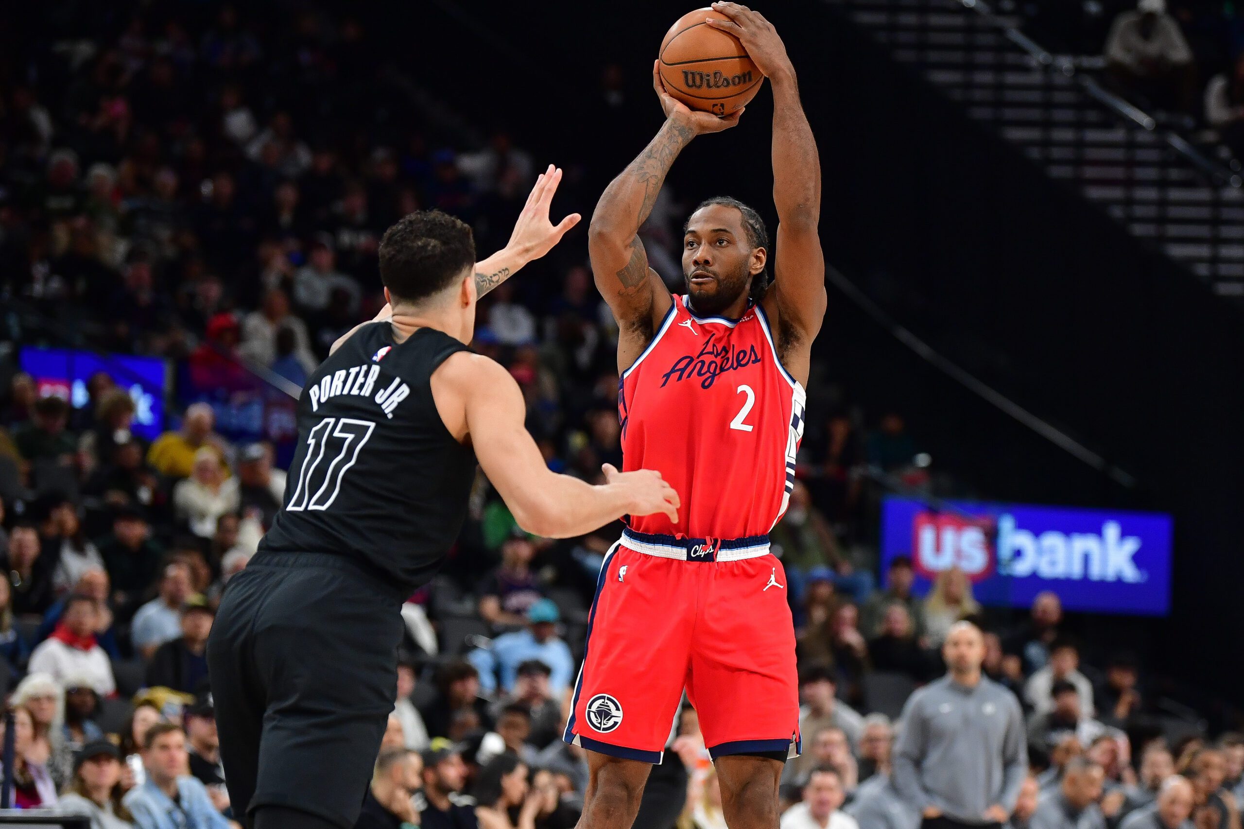 Jan 25, 2026; Inglewood, California, USA; Los Angeles Clippers forward Kawhi Leonard (2) shoots against Brooklyn Nets forward Michael Porter Jr. (17) during the first half at Intuit Dome. Mandatory Credit: Gary A. Vasquez-Imagn Images