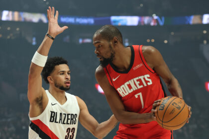 Jan 7, 2026; Portland, Oregon, USA; Portland Trail Blazers forward Toumani Camara (33) defends Houston Rockets forward Kevin Durant (7) during the first half at Moda Center. Mandatory Credit: Jaime Valdez-Imagn Images