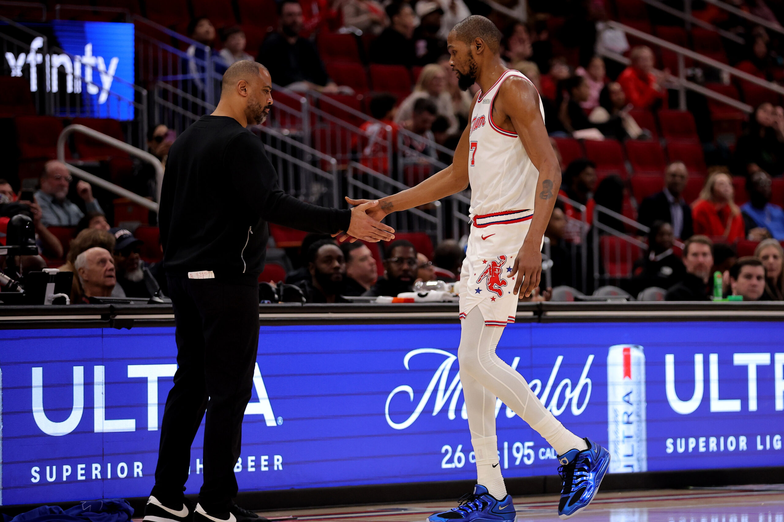 Jan 18, 2026; Houston, Texas, USA; Houston Rockets forward Kevin Durant (7) shakes hands with head coach Ime Udoka after leaving the game against the New Orleans Pelicans during the fourth quarter at Toyota Center. Mandatory Credit: Erik Williams-Imagn Images
