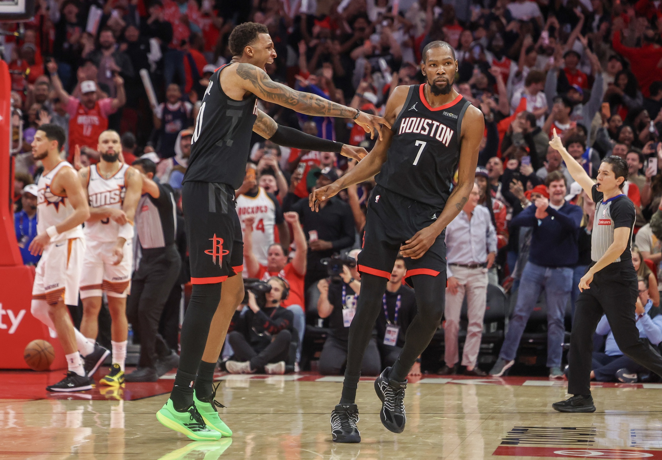 Jan 5, 2026; Houston, Texas, USA; Houston Rockets forward Jabari Smith Jr. (10) celebrates forward Kevin Durant (7) three point winning basket against the Phoenix Suns in the fourth quarter at Toyota Center. Mandatory Credit: Thomas Shea-Imagn Images