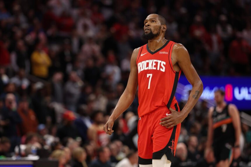 Jan 20, 2026; Houston, Texas, USA; Houston Rockets forward Kevin Durant (7) looks up at the replay board while playing against the San Antonio Spurs timeout in the second half at Toyota Center. Mandatory Credit: Thomas Shea-Imagn Images