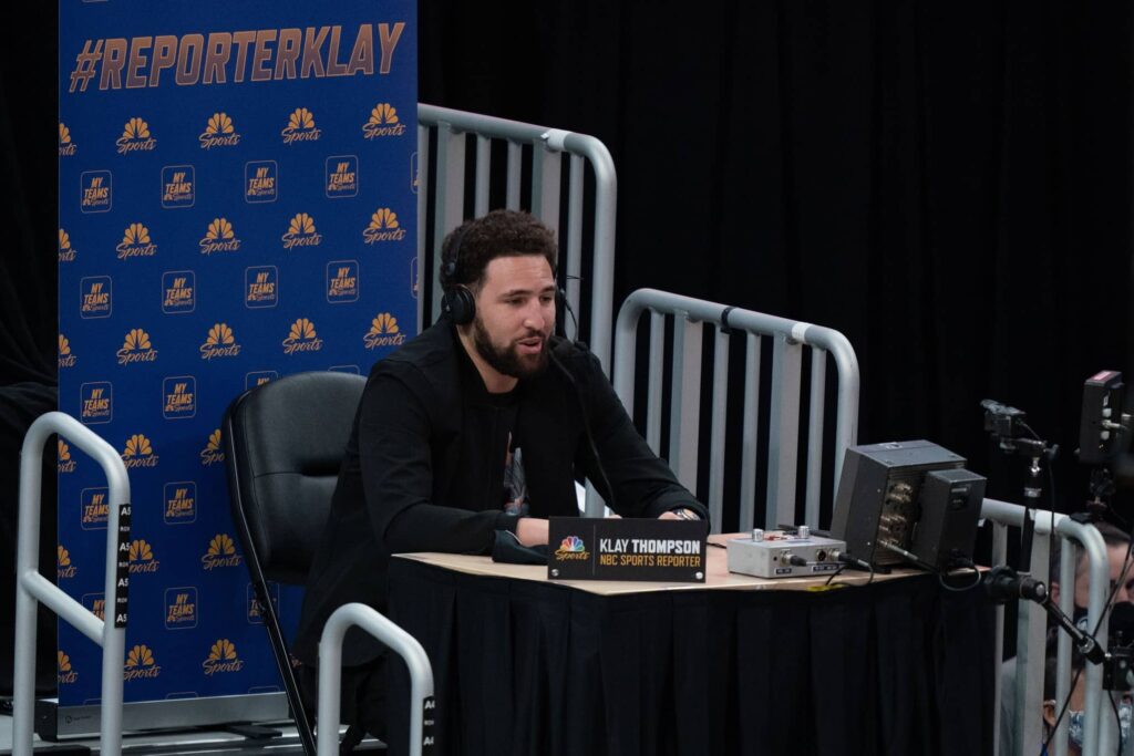 Golden State Warriors guard Klay Thompson (11) speaks as a TV reporter during the third quarter against the Detroit Pistons at Chase Center.