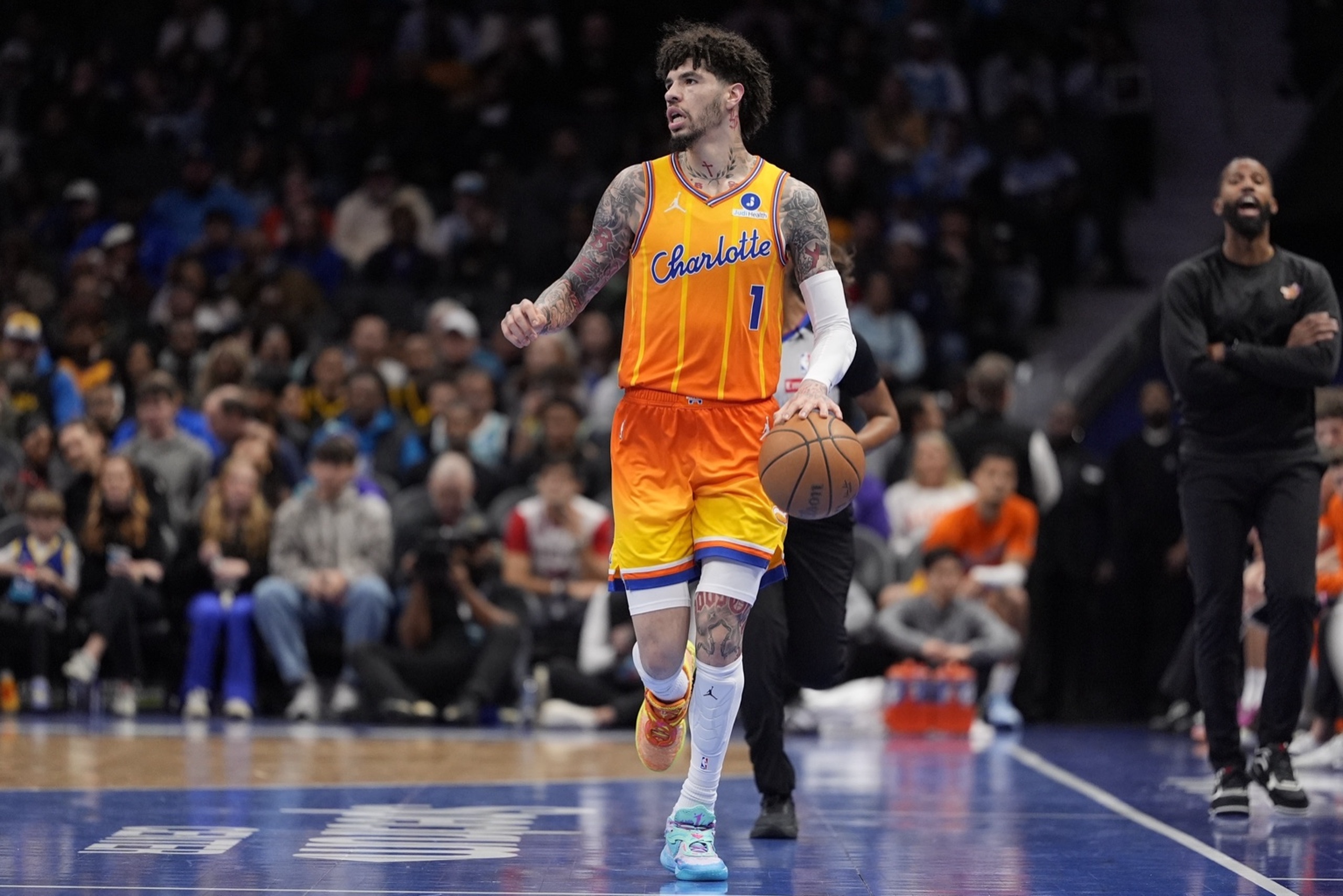 Dec 31, 2025; Charlotte, North Carolina, USA; Charlotte Hornets guard Lamelo Ball (1) brings the ball up court against the Golden State Warriors during the first quarter at Spectrum Center. Mandatory Credit: Jim Dedmon-Imagn Images