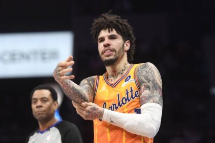 Charlotte, North Carolina, USA; Charlotte Hornets guard LaMelo Ball (1) rubs his elbow after falling during the second half against the Atlanta Hawks at the Spectrum Center. Mandatory Credit: Sam Sharpe-Imagn