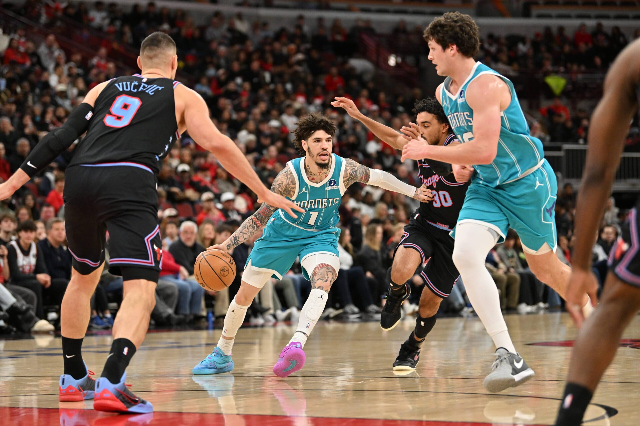 Jan 3, 2026; Chicago, Illinois, USA; Charlotte Hornets guard Lamelo Ball (1) drives the ball against Chicago Bulls guard Tre Jones (30) during the first half at United Center. Mandatory Credit: Patrick Gorski-Imagn Images