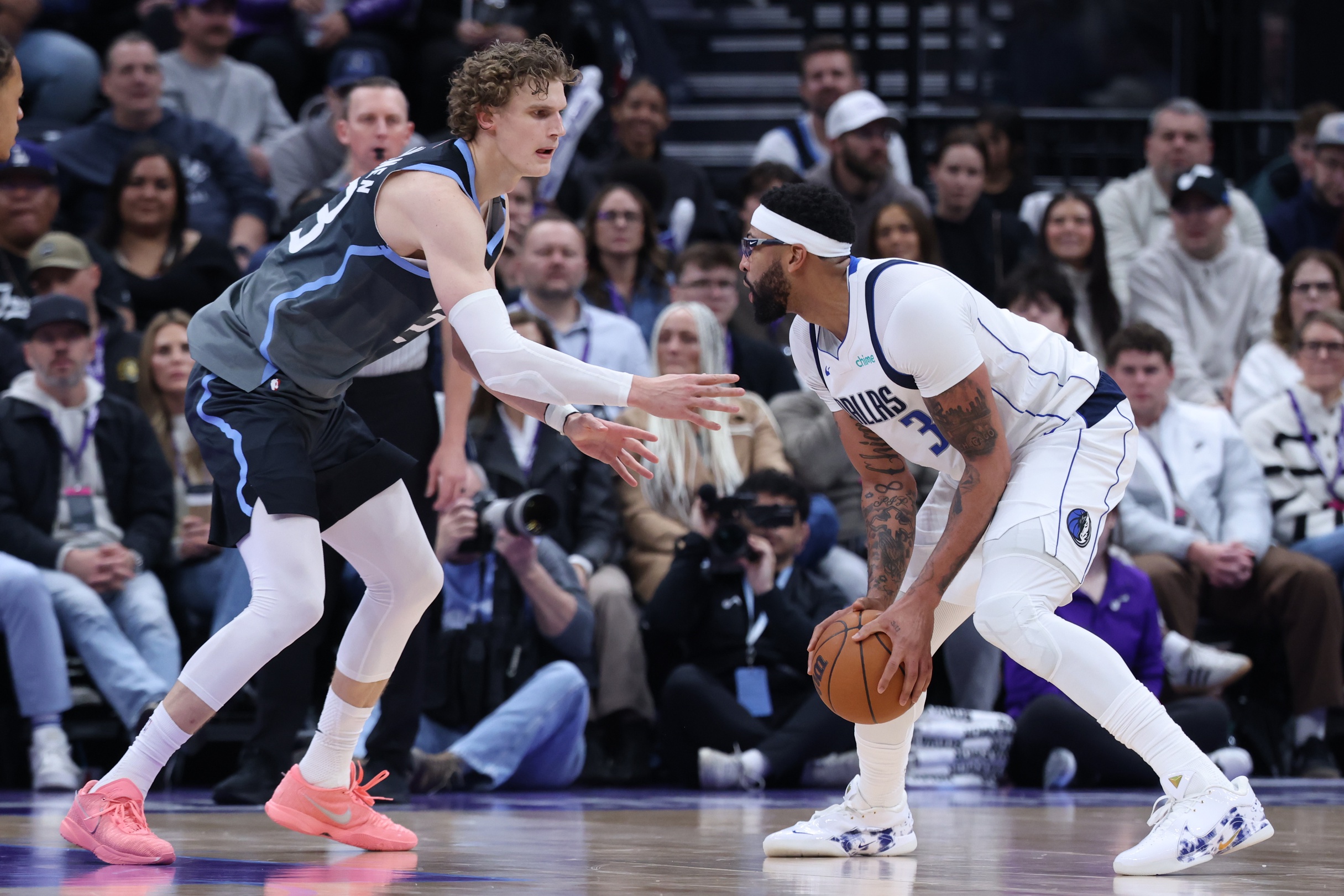 Jan 8, 2026; Salt Lake City, Utah, USA; Dallas Mavericks forward Anthony Davis (3) looks to drive against Utah Jazz forward Lauri Markkanen (23) during the second half at Delta Center. Mandatory Credit: Rob Gray-Imagn Images