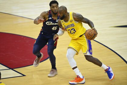 Jan 28, 2026; Cleveland, Ohio, USA; Los Angeles Lakers guard Luka Doncic (77) and forward LeBron James (23) stand on the court in the first quarter against the Cleveland Cavaliers at Rocket Arena. Mandatory Credit: David Richard-Imagn Images