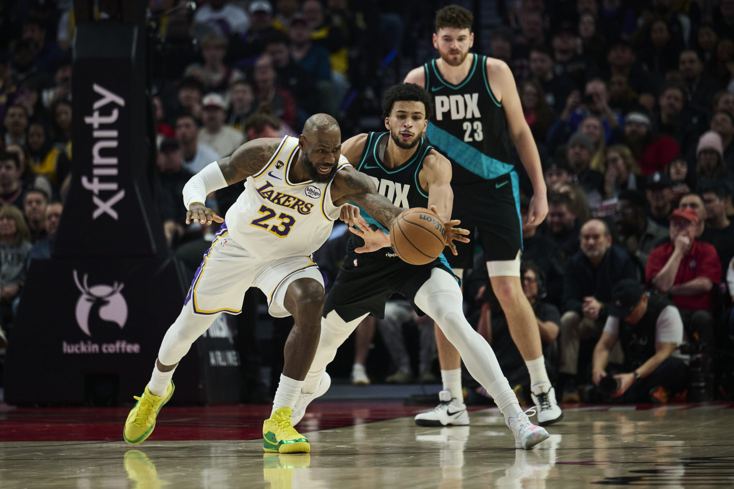 Jan 17, 2026; Portland, Oregon, USA; Los Angeles Lakers forward LeBron James (23) is fouled during the first half by Portland Trail Blazers forward Toumani Camara (33) at Moda Center. Mandatory Credit: Troy Wayrynen-Imagn Images