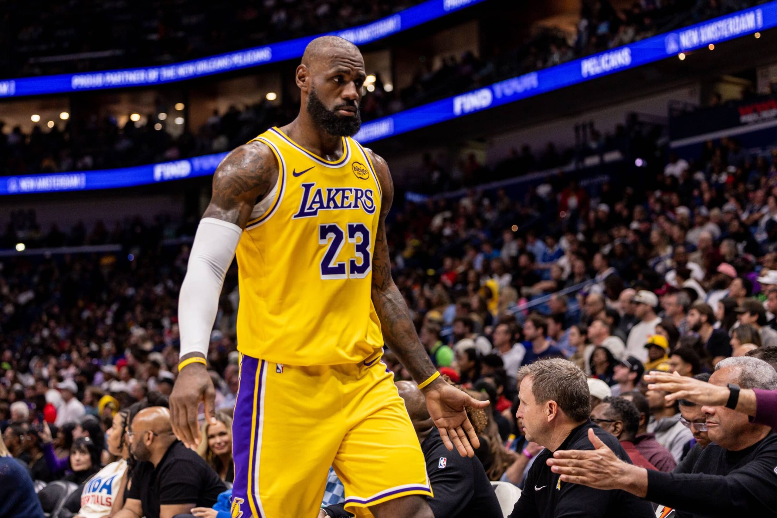 New Orleans, Louisiana, USA; Los Angeles Lakers forward LeBron James (23) returns to the bench against the New Orleans Pelicans during the second half at Smoothie King Center. Mandatory Credit: Stephen Lew-Imagn Images