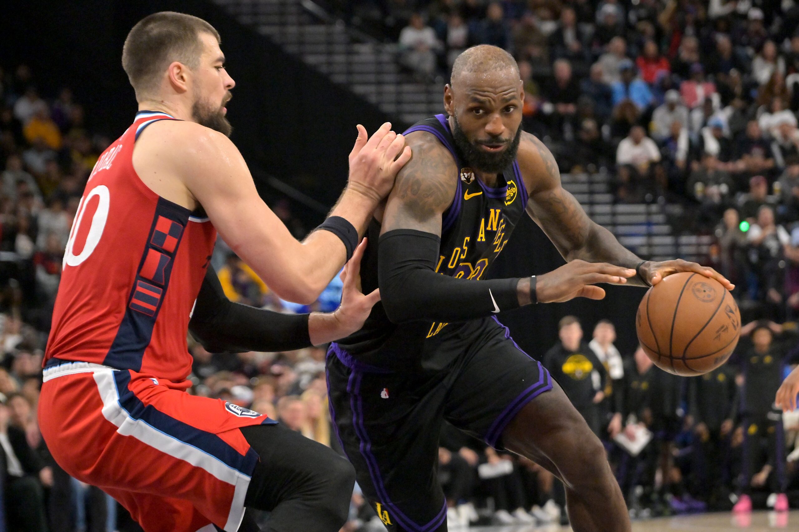 Jan 22, 2026; Inglewood, California, USA; Los Angeles Clippers center Ivica Zubac (40) defends Los Angeles Lakers forward LeBron James (23) as he drives to the basket in the second half at Intuit Dome. Mandatory Credit: Jayne Kamin-Oncea-Imagn Images