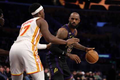 Los Angeles Lakers forward LeBron James (23) looks to pass the ball against Atlanta Hawks forward Onyeka Okongwu (17) during the third quarter at Crypto.com Arena.