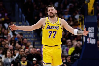 Denver, Colorado, USA; Los Angeles Lakers guard Luka Doncic (77) reacts after a play in the third quarter against the Denver Nuggets at Ball Arena. Mandatory Credit: Isaiah J. Downing-Imagn Images