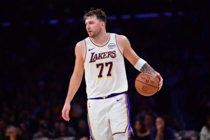 Los Angeles, California, USA; Los Angeles Lakers guard Luka Doncic (77) controls the ball against the New Orleans Pelicans during the first half at Crypto.com Arena. Mandatory Credit: Gary A. Vasquez-Imagn Images