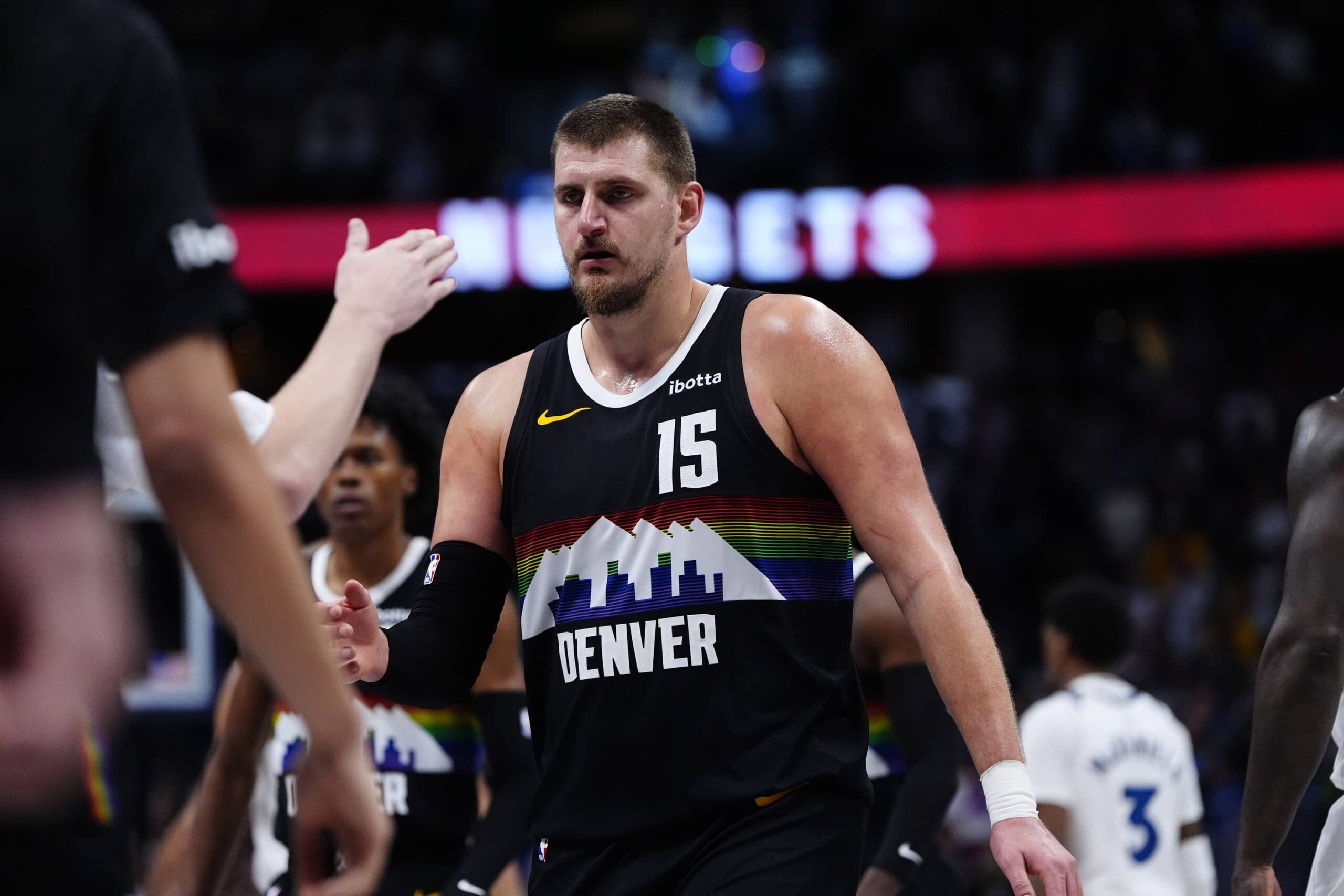 Dec 25, 2025; Denver, Colorado, USA; Denver Nuggets center Nikola Jokic (15) comes to the bench in overtime against the Minnesota Timberwolves at Ball Arena. Mandatory Credit: Ron Chenoy-Imagn Images