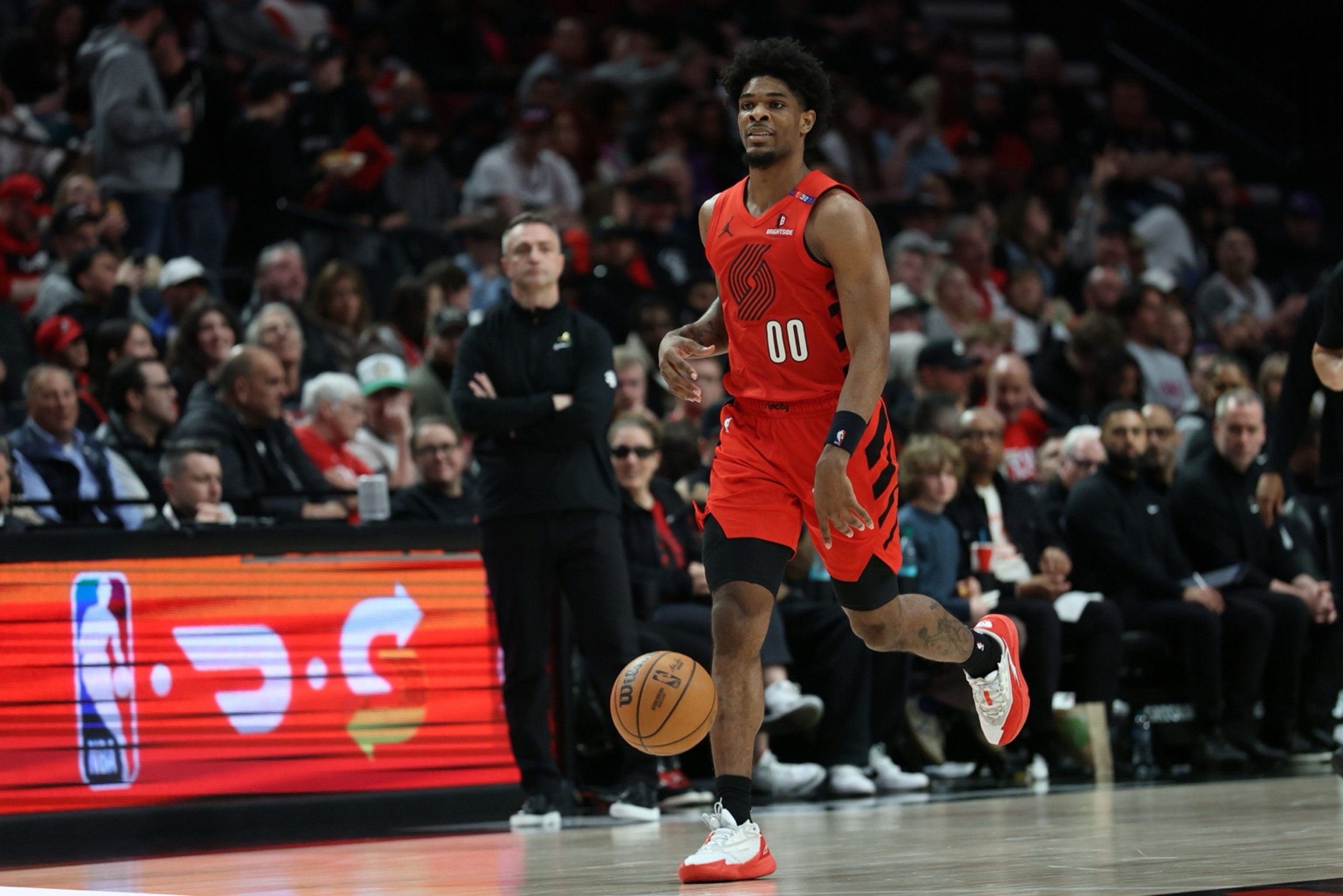 Mar 16, 2025; Portland, Oregon, USA; Portland Trail Blazers guard Scoot Henderson (00) brings the ball up the court against the Toronto Raptors in the second half at Moda Center. Mandatory Credit: Jaime Valdez-Imagn Images