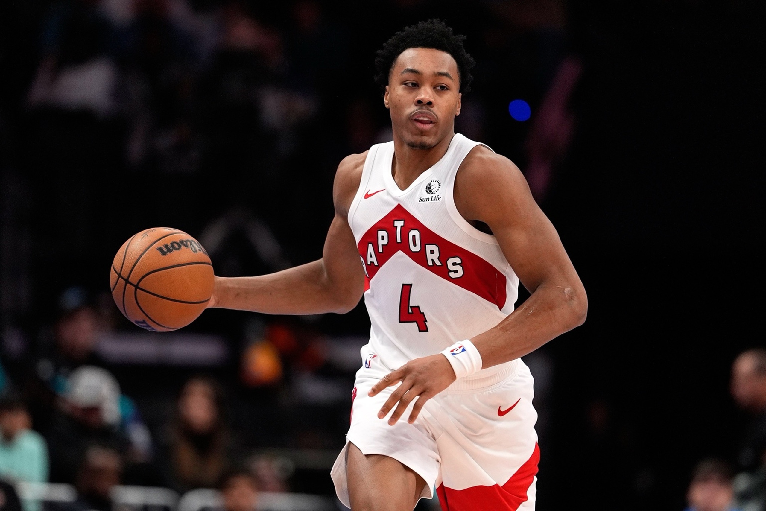 Nov 29, 2025; Charlotte, North Carolina, USA; Toronto Raptors forward Scottie Barnes (4) brings the ball up court against the Charlotte Hornets during the second half at Spectrum Center. Mandatory Credit: Jim Dedmon-Imagn Images