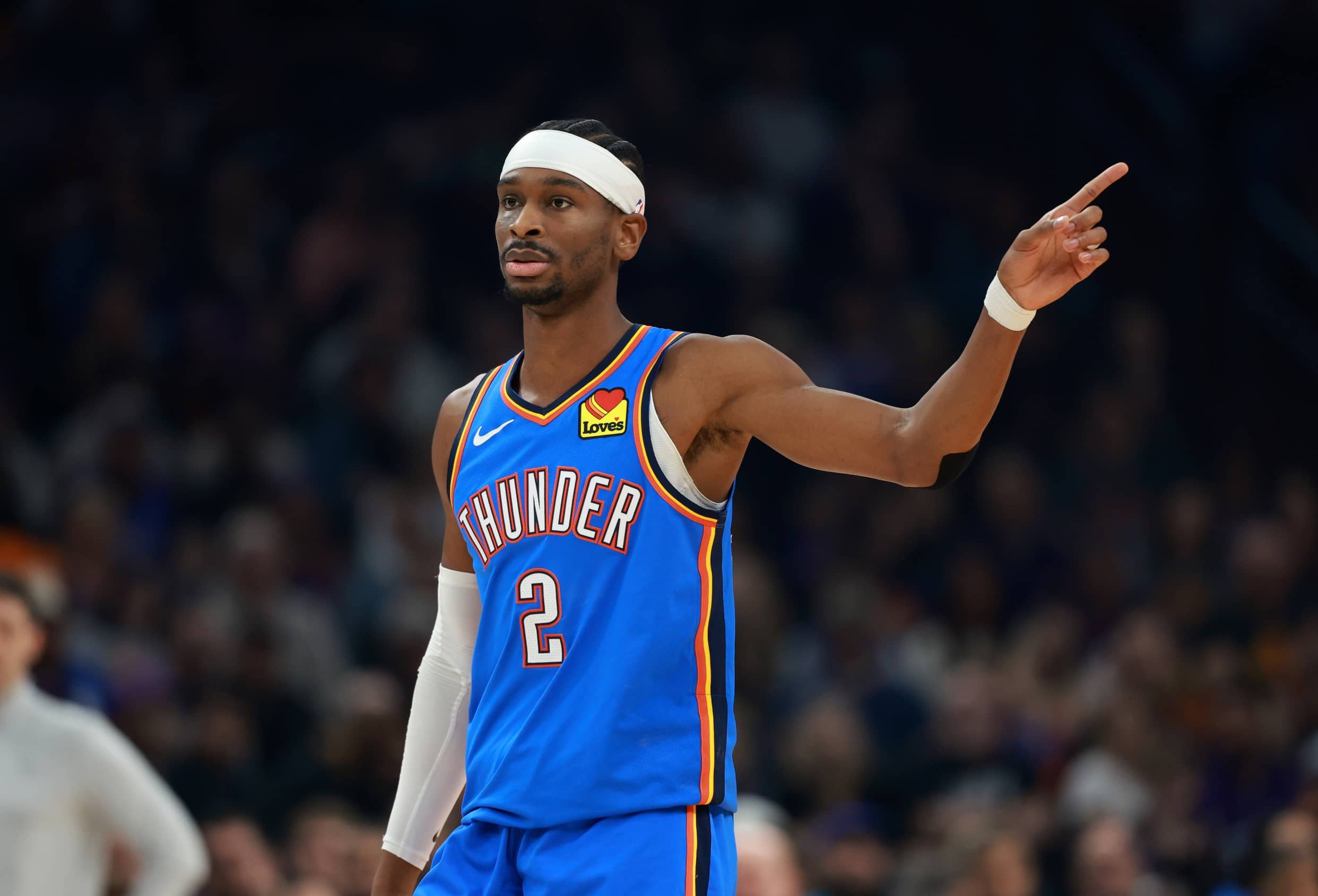 Jan 4, 2026; Phoenix, Arizona, USA; Oklahoma City Thunder guard Shai Gilgeous-Alexander (2) against the Phoenix Suns in the first half at Mortgage Matchup Center. Mandatory Credit: Mark J. Rebilas-Imagn Images