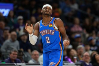 Phoenix, Arizona, USA; Oklahoma City Thunder guard Shai Gilgeous-Alexander (2) against the Phoenix Suns in the first half at Mortgage Matchup Center. Mandatory Credit: Mark J. Rebilas-Imagn Images