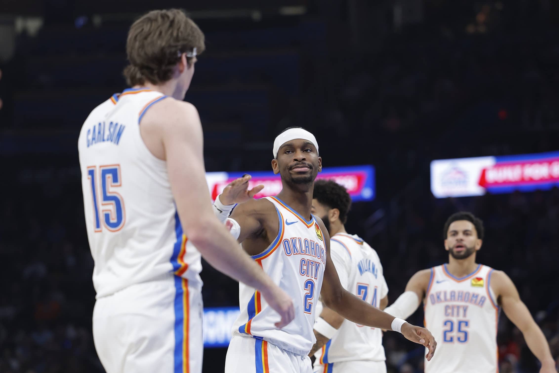 Jan 5, 2026; Oklahoma City, Oklahoma, USA; Oklahoma City Thunder guard Shai Gilgeous-Alexander (2) high fives center Branden Carlson (15) after a play against the Charlotte Hornets during the second quarter at Paycom Center. Mandatory Credit: Alonzo Adams-Imagn Images