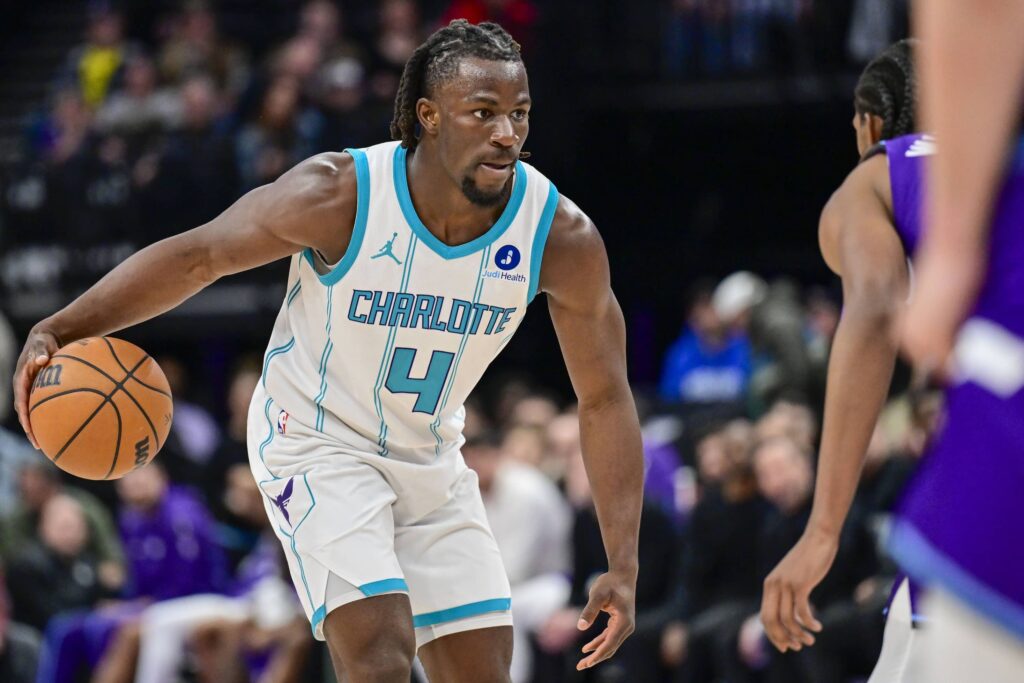 Jan 10, 2026; Salt Lake City, Utah, USA; Charlotte Hornets guard Sion James (4) stares down Utah Jazz forward Cody Williams (5) during the second half at Delta Center. Mandatory Credit: Peter Creveling-Imagn Images