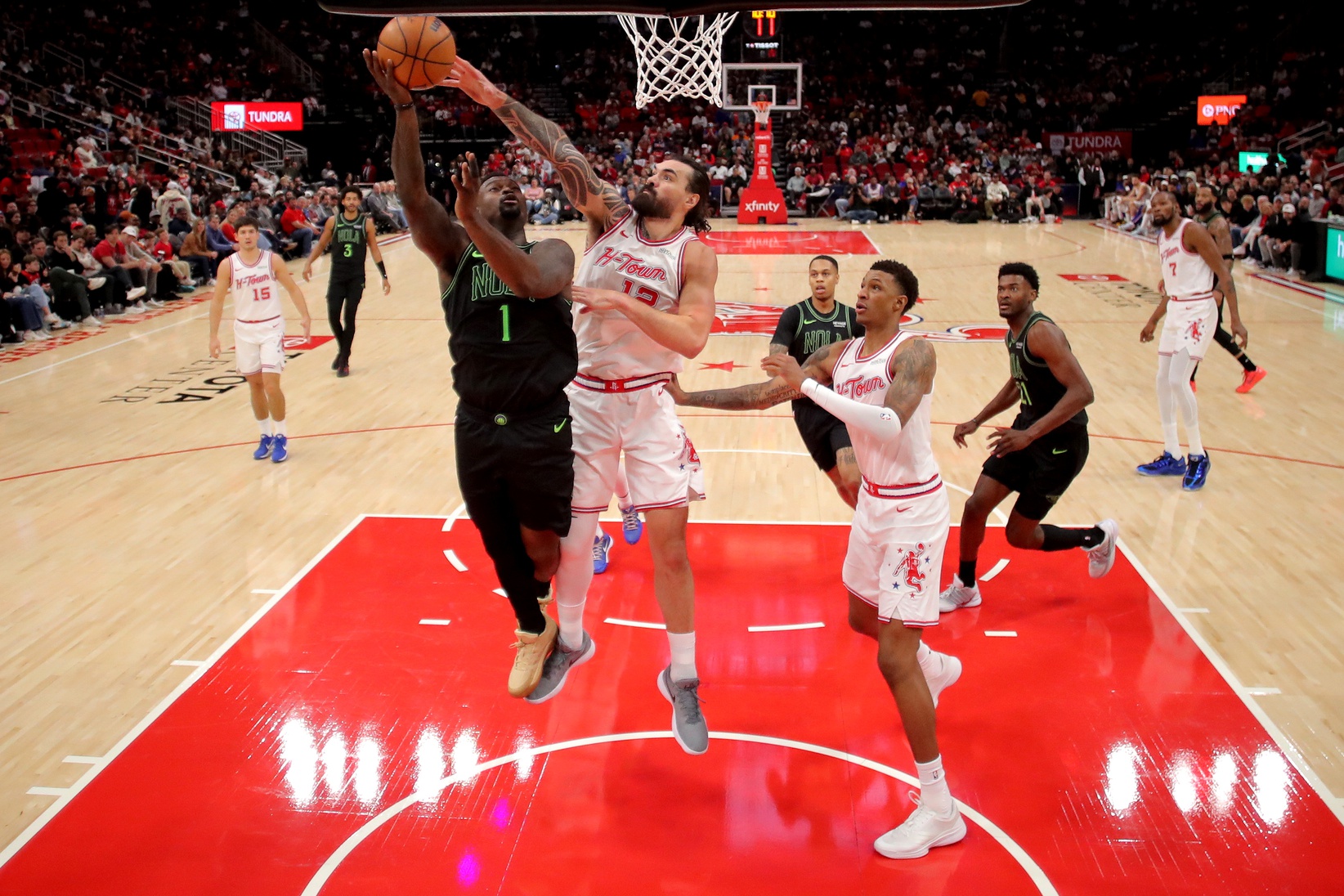 Jan 18, 2026; Houston, Texas, USA; New Orleans Pelicans forward Zion Williamson (1) shoots against Houston Rockets center Steven Adams (12) during the second quarter at Toyota Center. Mandatory Credit: Erik Williams-Imagn Images