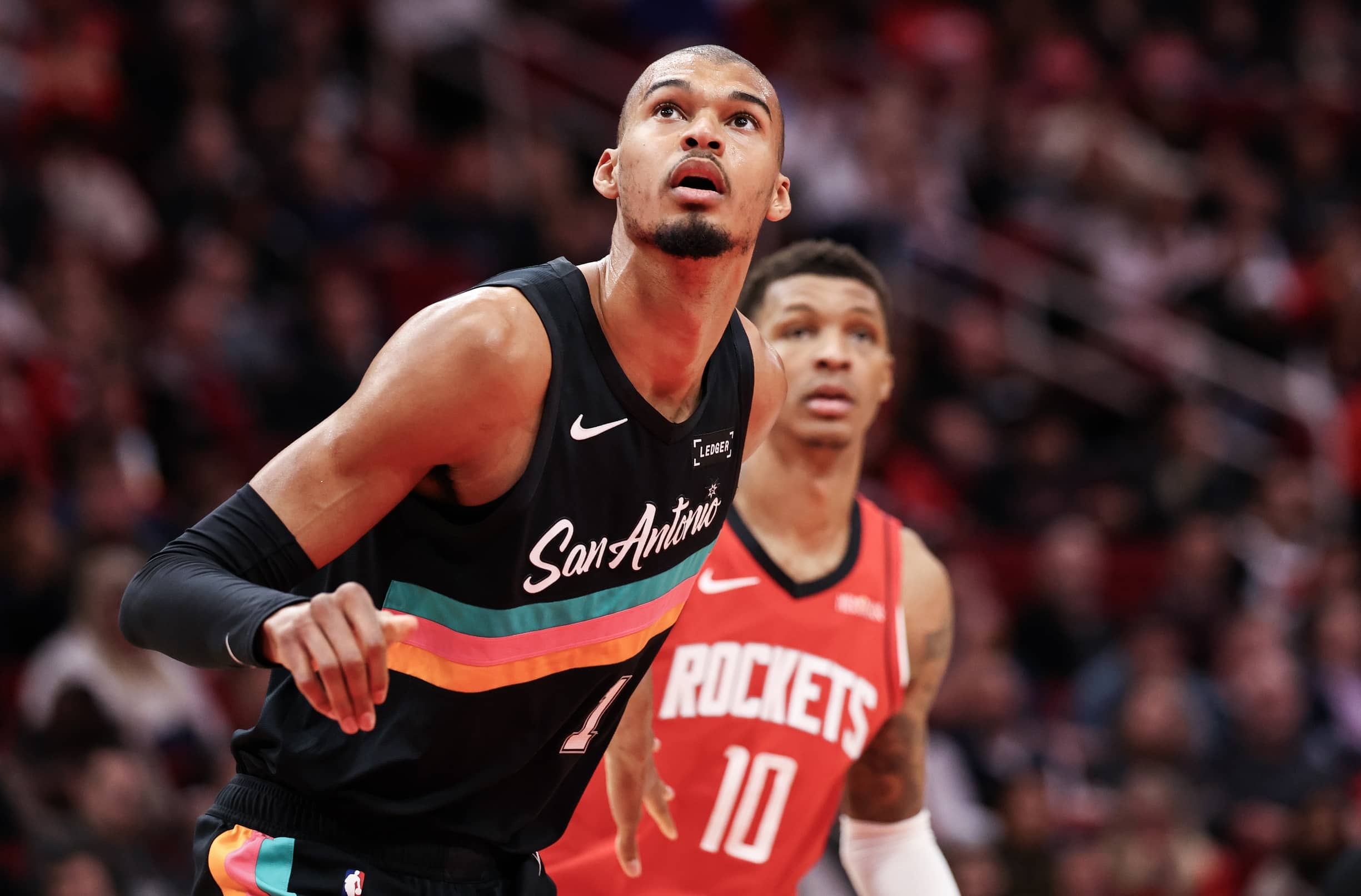 Jan 20, 2026; Houston, Texas, USA;San Antonio Spurs forward Victor Wembanyama (1) boxes Houston Rockets forward Jabari Smith Jr. (10) out after a Rockets free-throw in the second quarter at Toyota Center. Mandatory Credit: Thomas Shea-Imagn Images