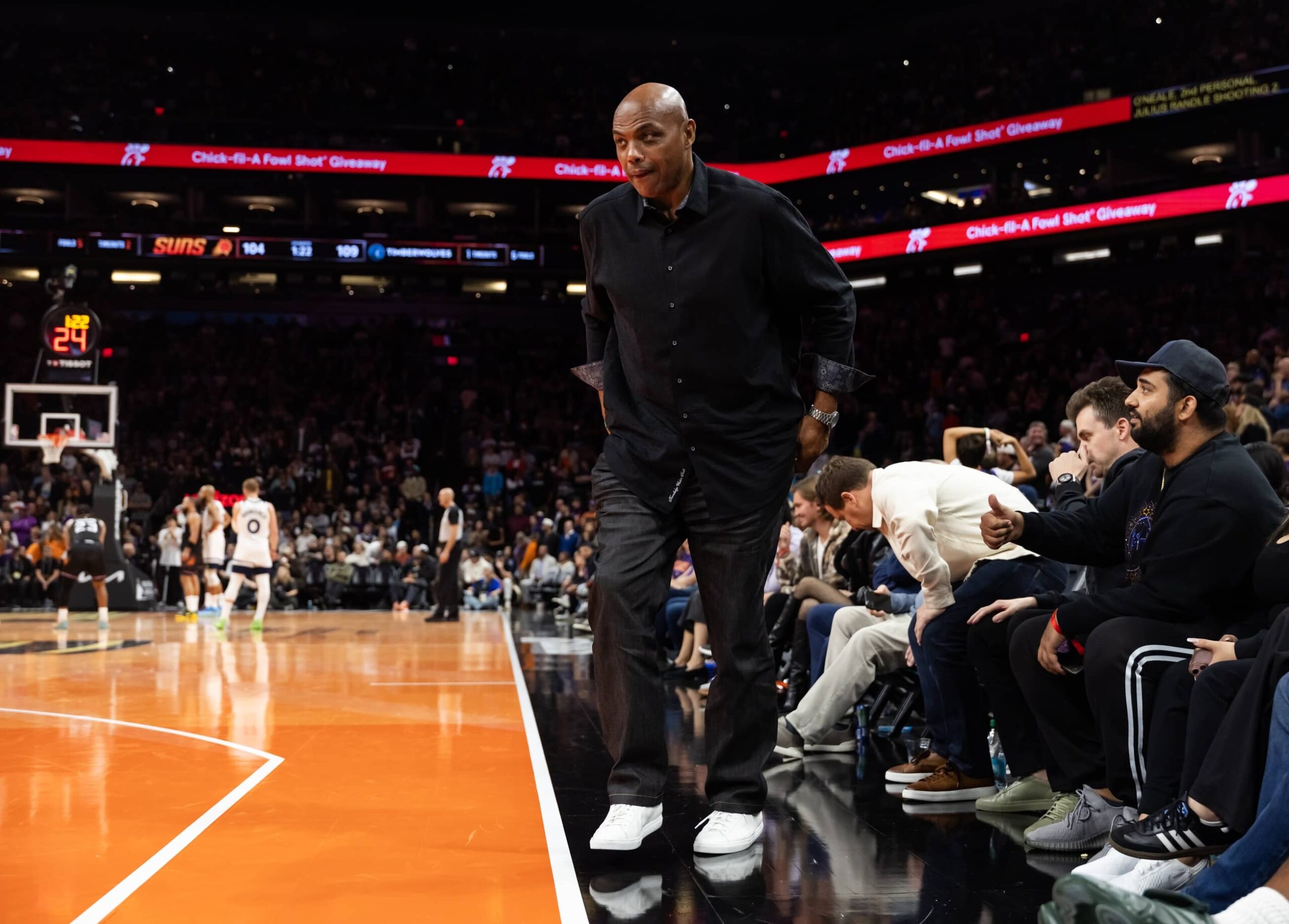 Phoenix, Arizona, USA; Phoenix Suns former player Charles Barkley walks off the court in the fourth quarter against the Minnesota Timberwolves during an NBA Cup game at Mortgage Matchup Center. Mandatory Credit: Mark J. Rebilas-Imagn Images