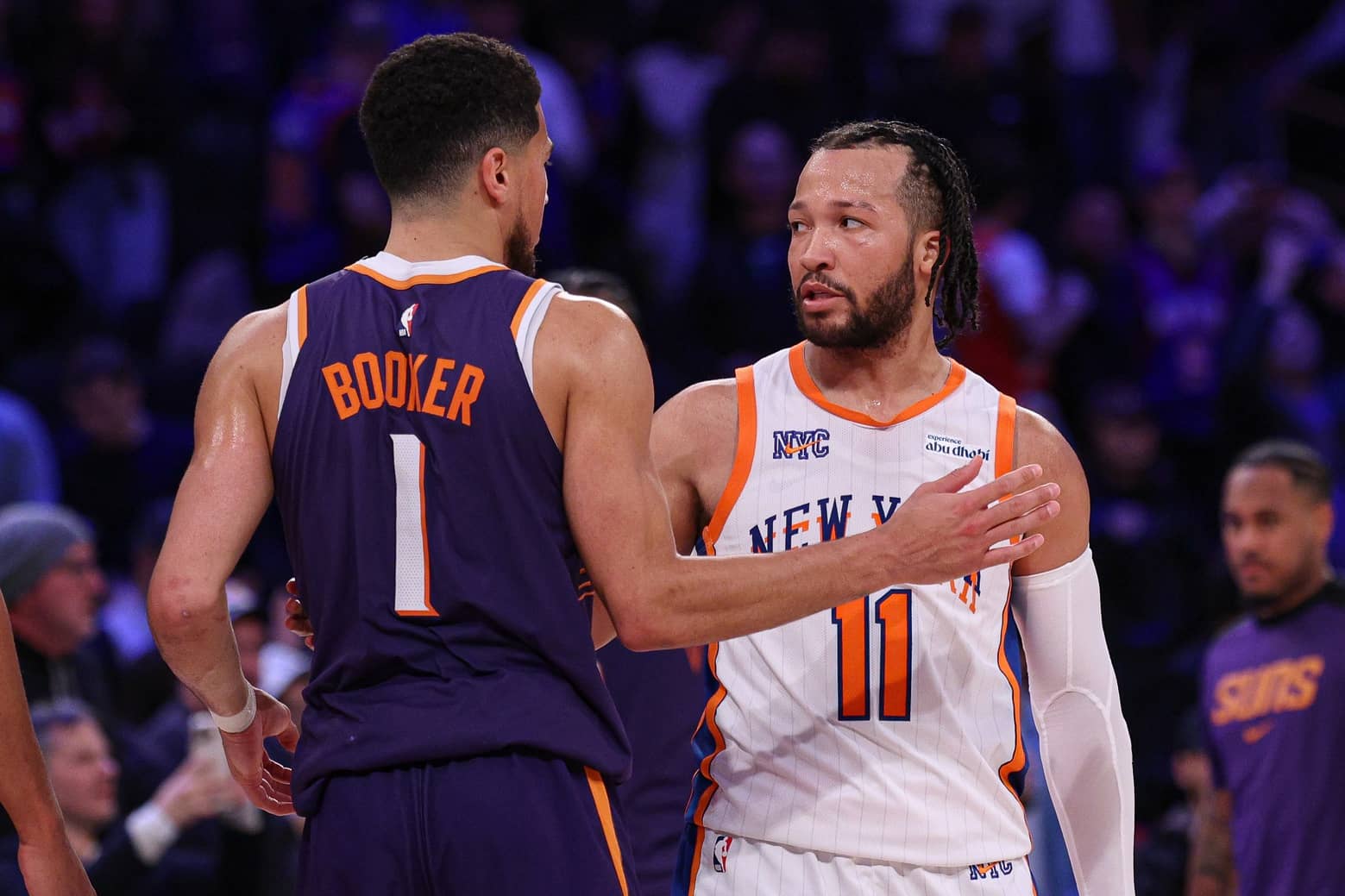 New York, New York, USA; New York Knicks guard Jalen Brunson (11) greets Phoenix Suns guard Devin Booker (1) after the game at Madison Square Garden. Mandatory Credit: Vincent Carchietta-Imagn Images