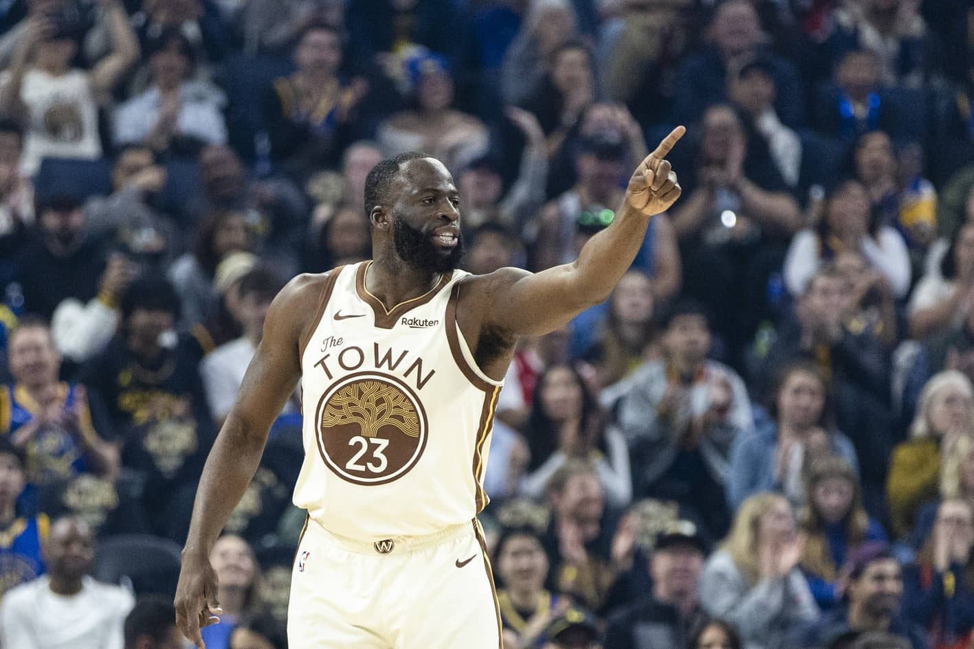 San Francisco, California, USA; Golden State Warriors forward Draymond Green (23) reacts after hitting a three-point shot against the Charlotte Hornets during the first quarter at Chase Center. Mandatory Credit: John Hefti-Imagn Images