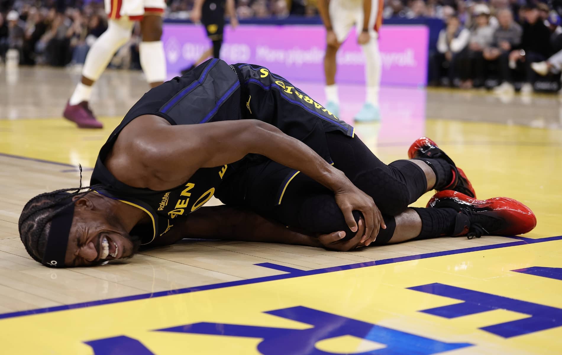 Jan 19, 2026; San Francisco, California, USA; Golden State Warriors forward Jimmy Butler III (10) holds his right knee as he goes down with an injury during the third quarter against the Miami Heat at Chase Center. Mandatory Credit: Kelley L Cox-Imagn Images