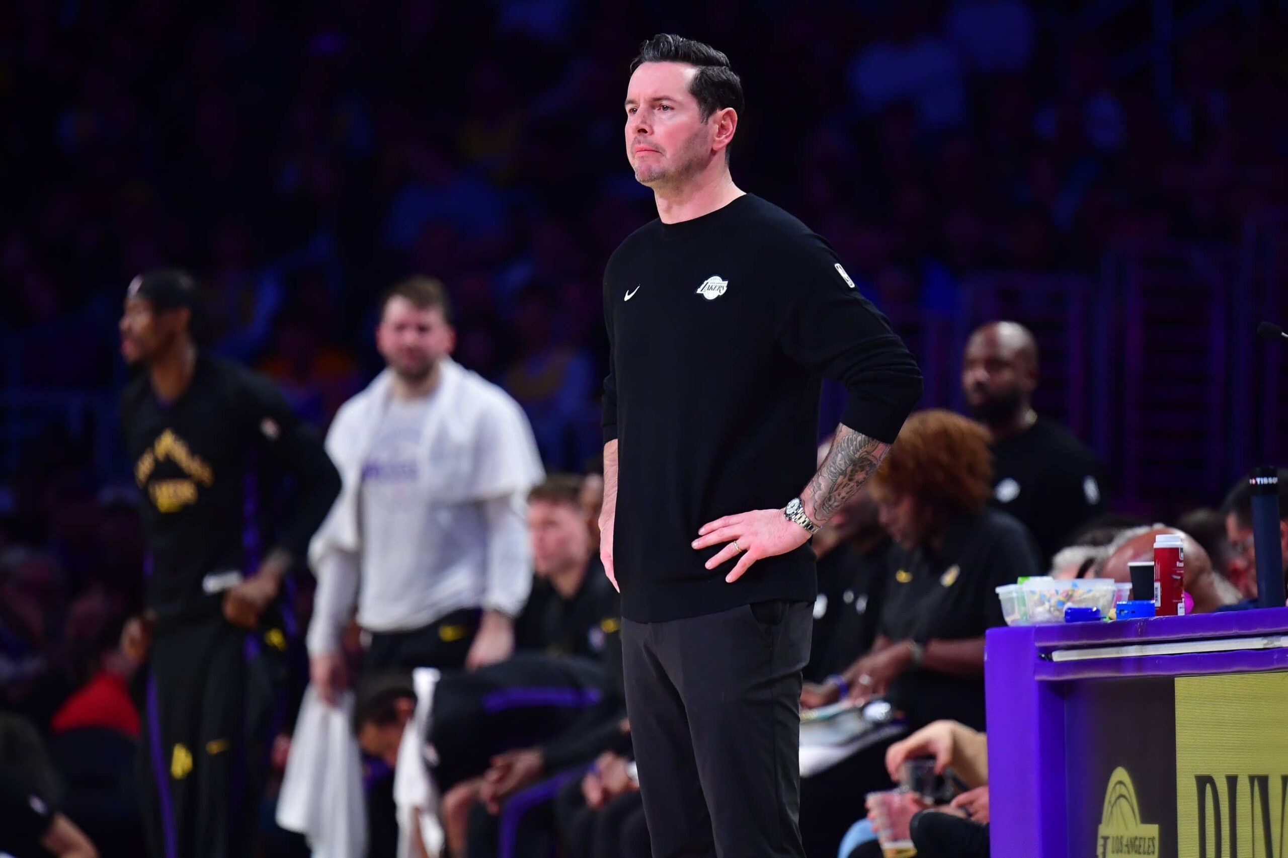 Los Angeles, California, USA; Los Angeles Lakers head coach JJ Redick watches game action against the Detroit Pistons during the first half at Crypto.com Arena. Mandatory Credit: Gary A. Vasquez-Imagn Images