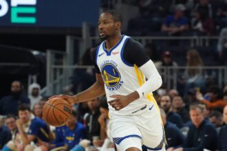 San Francisco, California, USA; Golden State Warriors forward Jonathan Kuminga (1) looks to pass against the Toronto Raptors in the second quarter at Chase Center. Mandatory Credit: David Gonzales-Imagn Images