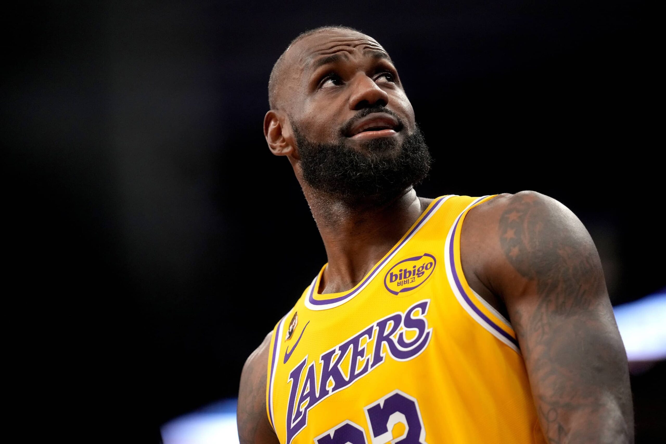 Sacramento, California, USA; Los Angeles Lakers forward LeBron James (23) walks towards the team bench during a break in the action against the Sacramento Kings in the third quarter at the Golden 1 Center. Mandatory Credit: Cary Edmondson-Imagn Images