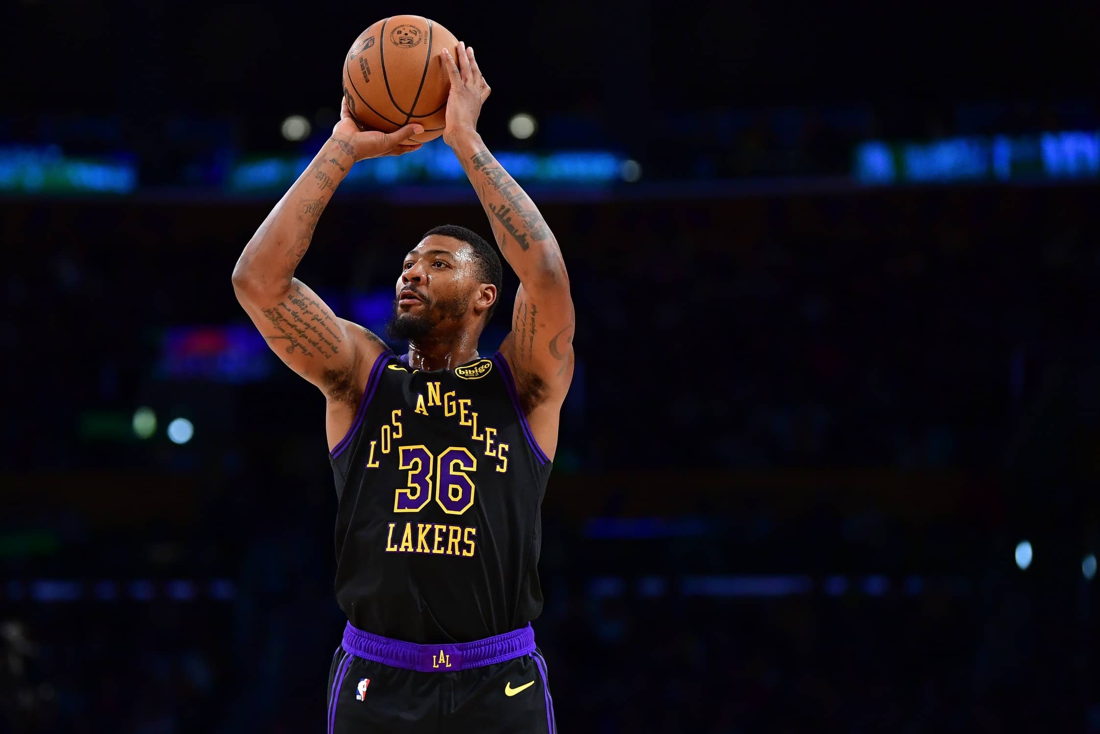 Los Angeles, California, USA; Los Angeles Lakers guard Marcus Smart (36) shoots against the Detroit Pistons during the second half at Crypto.com Arena. Mandatory Credit: Gary A. Vasquez-Imagn Images
