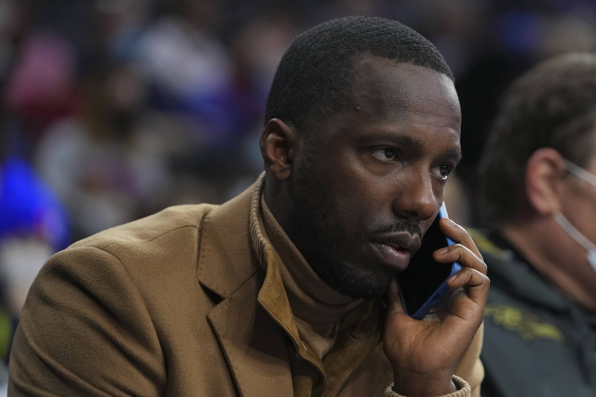 Philadelphia, Pennsylvania, USA; NBA agent Rich Paul talks on the phone prior to the game between the Charlotte Hornets and Philadelphia 76ers at the Wells Fargo Center. Mandatory Credit: Mitchell Leff-Imagn Images