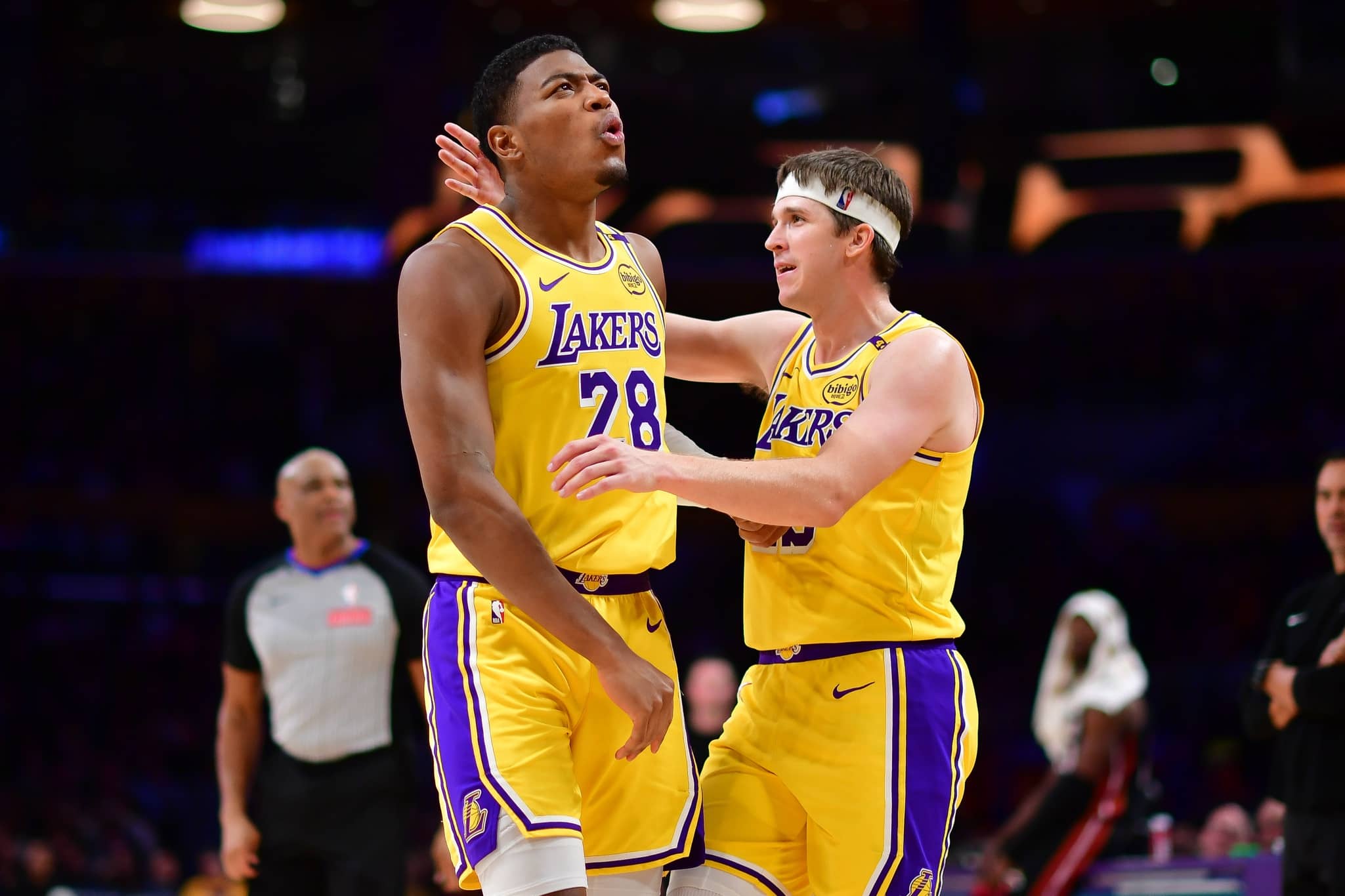 Los Angeles, California, USA; Los Angeles Lakers forward Rui Hachimura (28) reacts with guard Austin Reaves (15) after scoring a basket and drawing the foul against the Miami Heat during the second half at Crypto.com Arena. Mandatory Credit: Gary A. Vasquez-Imagn Images