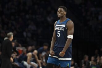 Minnesota Timberwolves guard Anthony Edwards (5) celebrates Minnesota Timberwolves forward Julius Randle (not pictured) making a shot against the Portland Trail Blazers in the second half at Target Center. Mandatory Credit: Jesse Johnson-Imagn Images