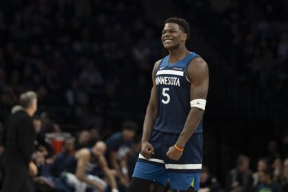 Minnesota Timberwolves guard Anthony Edwards (5) celebrates Minnesota Timberwolves forward Julius Randle (not pictured) making a shot against the Portland Trail Blazers in the second half at Target Center. Mandatory Credit: Jesse Johnson-Imagn Images