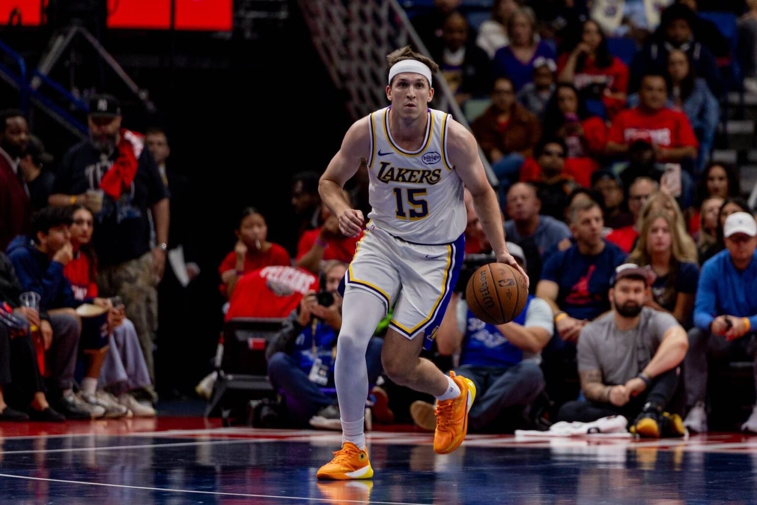 Nov 14, 2025; New Orleans, Louisiana, USA; Los Angeles Lakers guard Austin Reaves (15) brings the ball up court against the New Orleans Pelicans during the first half at Smoothie King Center. Mandatory Credit: Stephen Lew-Imagn Images
