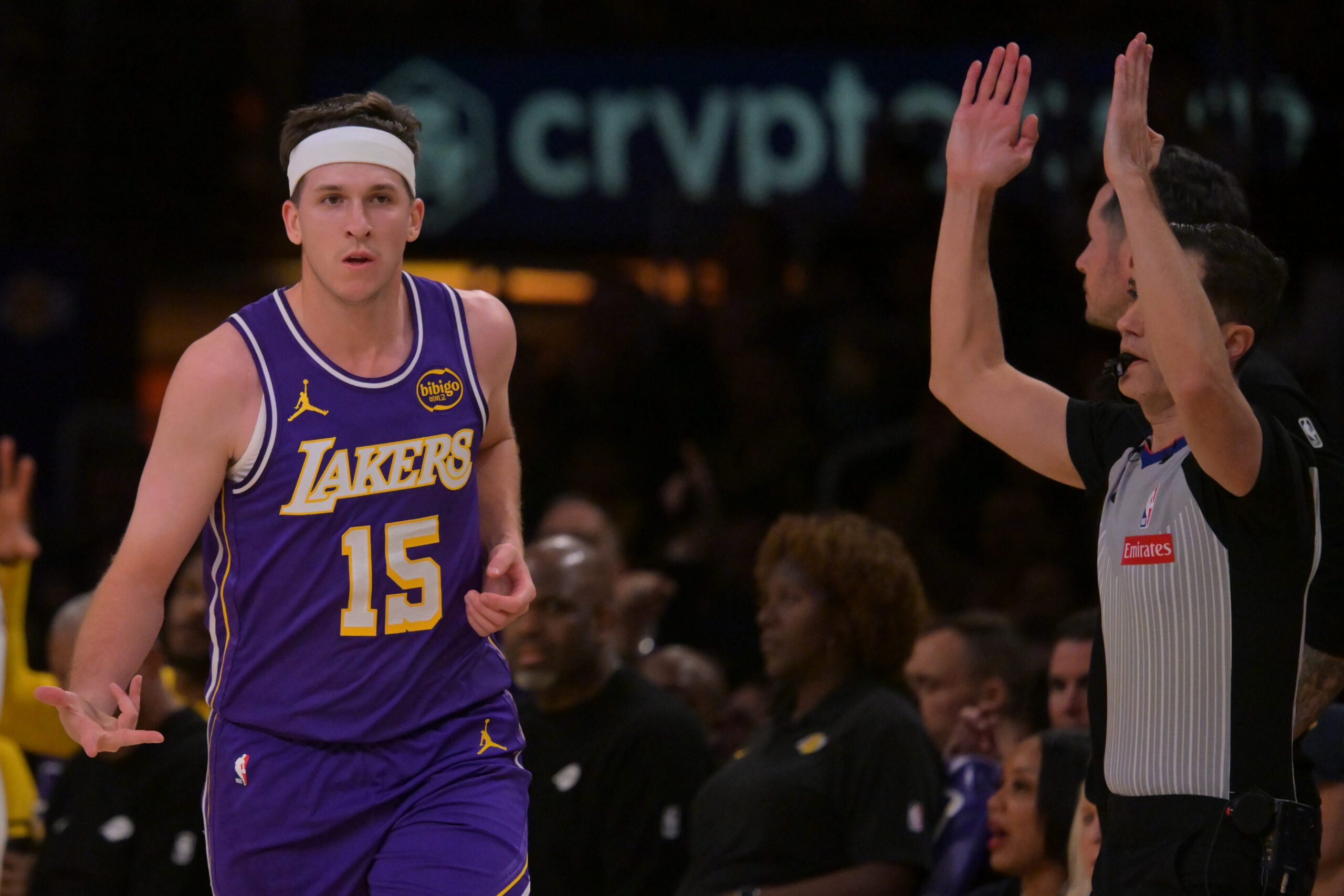 Feb 5, 2026; Los Angeles, California, USA; Los Angeles Lakers guard Austin Reaves (15) heads down court after a three-point basket in the first half against the Philadelphia 76ers at Crypto.com Arena. Mandatory Credit: Jayne Kamin-Oncea-Imagn Images