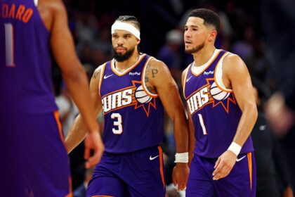 Oct 22, 2025; Phoenix, Arizona, USA; Phoenix Suns guard Devin Booker (1) and forward Dillon Brooks (3) during the second half against the Sacramento Kings at the Mortgage Matchup Center. Mandatory Credit: Mark J. Rebilas-Imagn Images