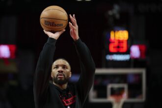 Dec 29, 2025; Portland, Oregon, USA; Portland Trail Blazers guard Damian Lillard (0) warms up before a game against the Dallas Mavericks at Moda Center. Mandatory Credit: Troy Wayrynen-Imagn Images