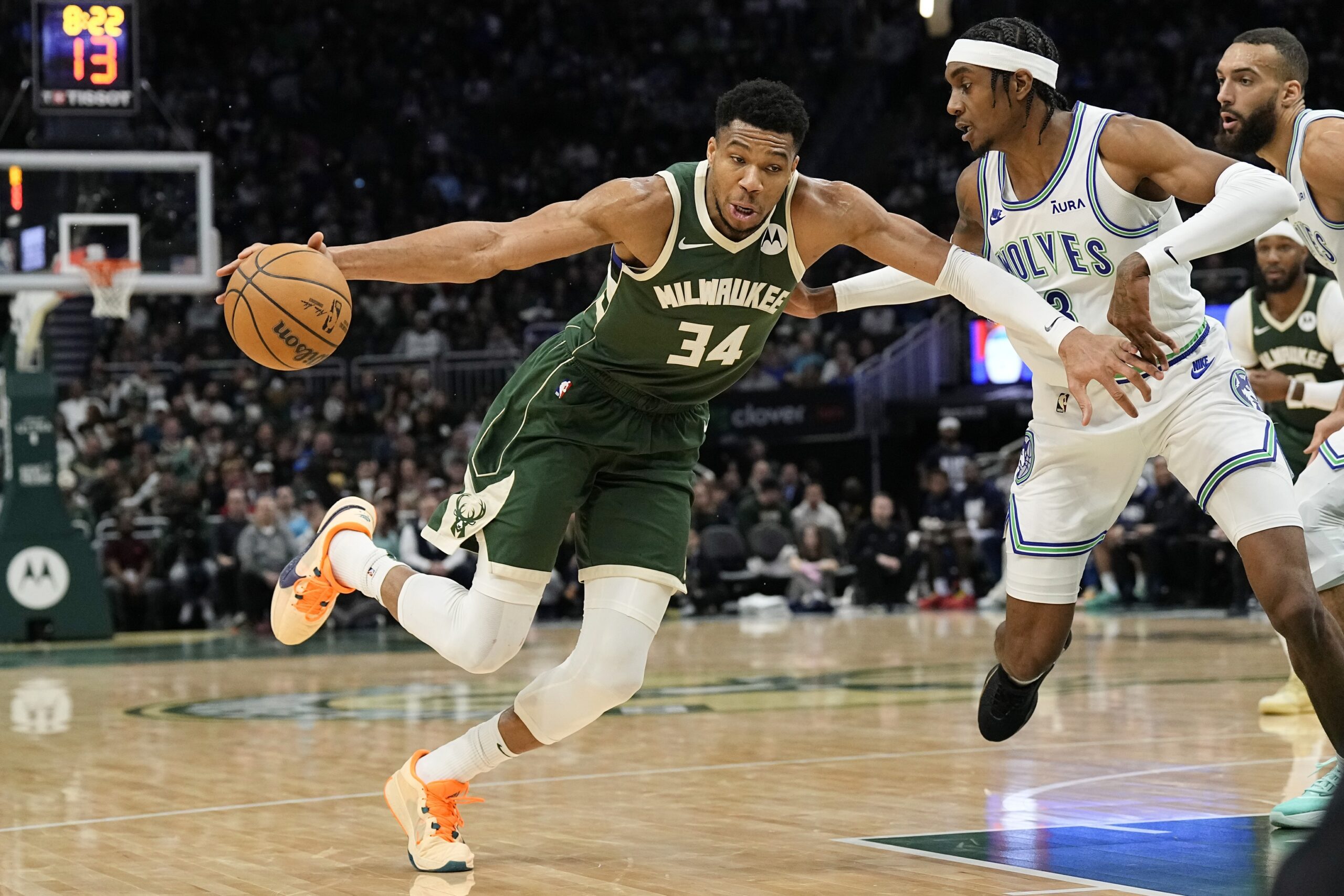 Feb 8, 2024; Milwaukee, Wisconsin, USA; Milwaukee Bucks forward Giannis Antetokounmpo (34) drives for the basket against Minnesota Timberwolves forward Jaden McDaniels (3) during the third quarter at Fiserv Forum. Mandatory Credit: Jeff Hanisch-USA TODAY Sports