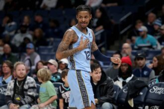 Jan 21, 2026; Memphis, Tennessee, USA; Memphis Grizzlies guard Ja Morant (12) reacts during the first quarter against the Atlanta Hawks at FedExForum. Mandatory Credit: Petre Thomas-Imagn Images